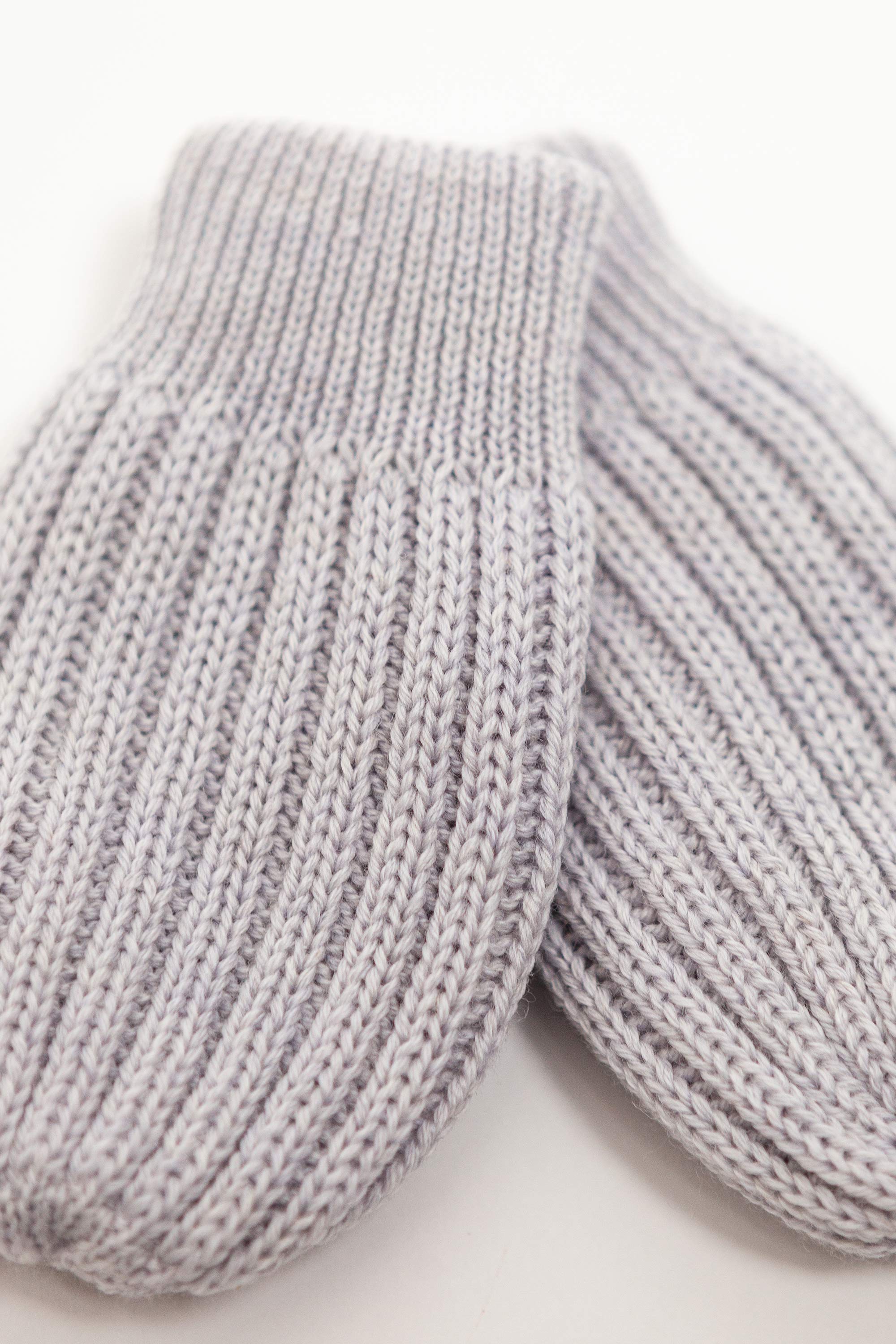 grey merino wool baby mittens worn – tiny hands kept warm naturally