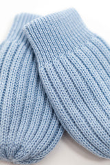 blue merino wool baby mittens worn – tiny hands kept warm naturally