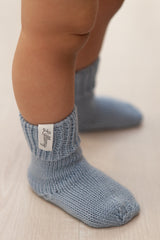 blue merino wool baby socks worn – soft and warm from birth