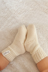 cream merino wool baby socks worn – soft and warm from birth