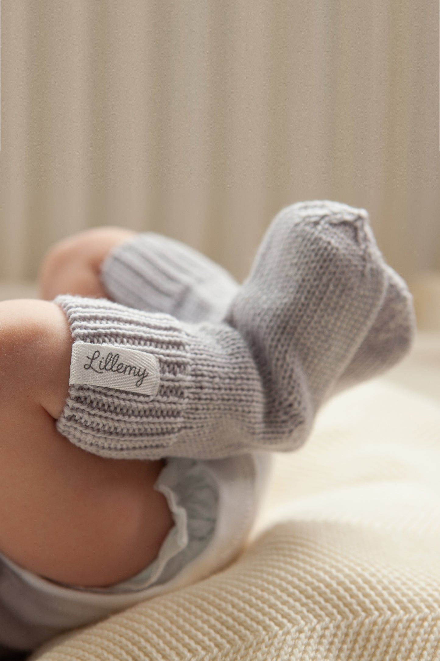 grey merino wool baby socks worn – soft and warm from birth